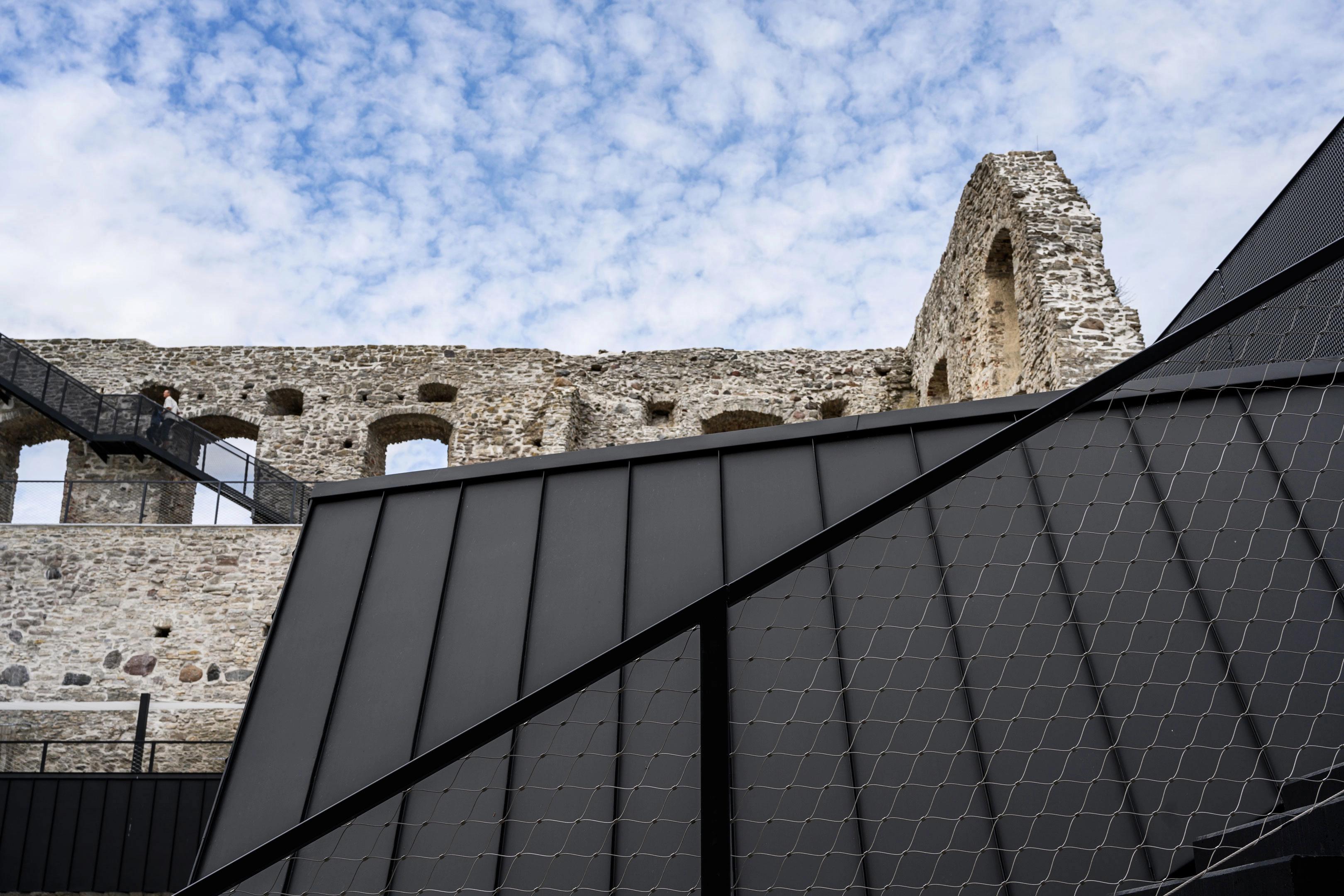 New black staircases on the walls of Haapsalu Castle by KAOS Arhitektid