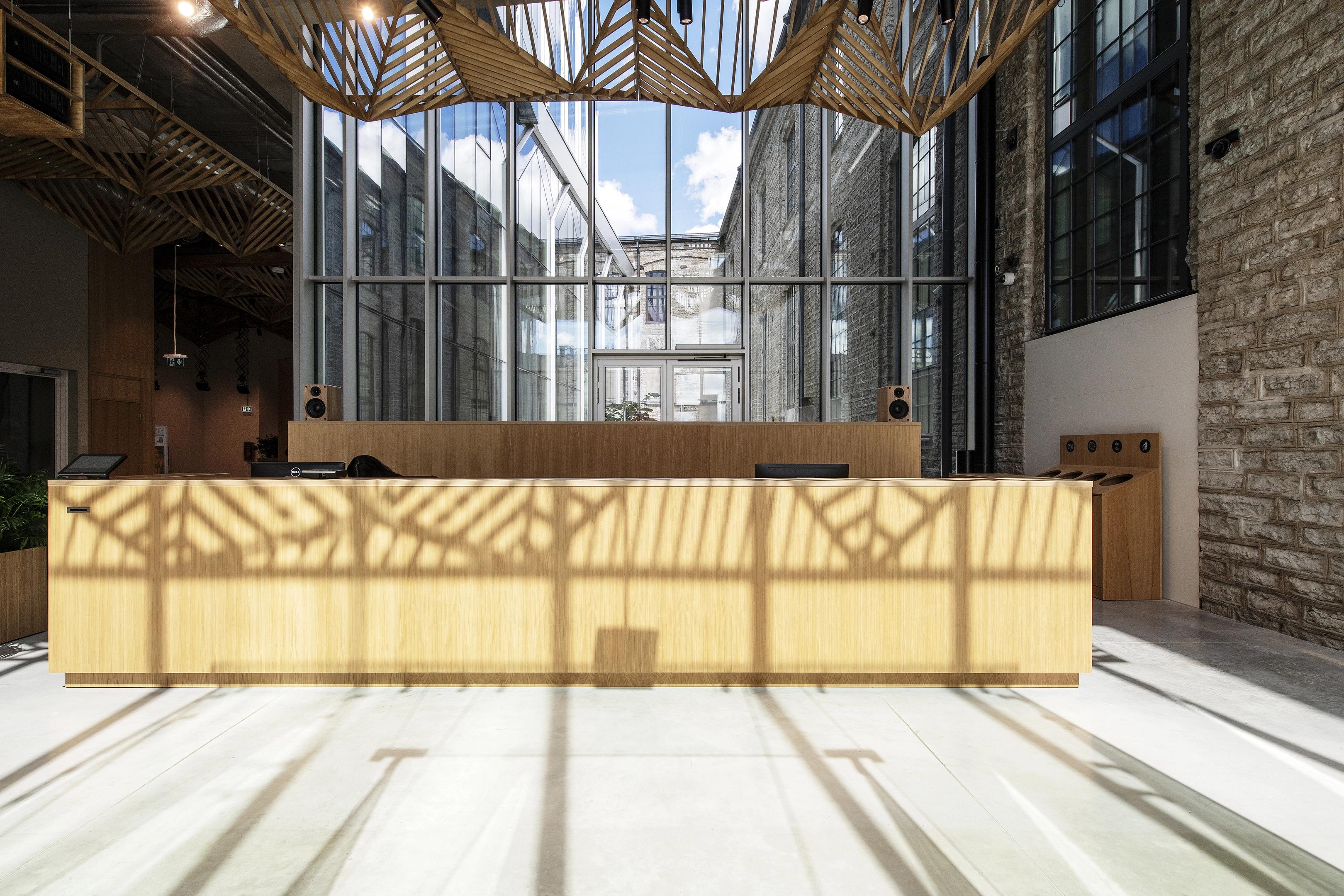 Wooden front desk inside of the headquarters of Postimees